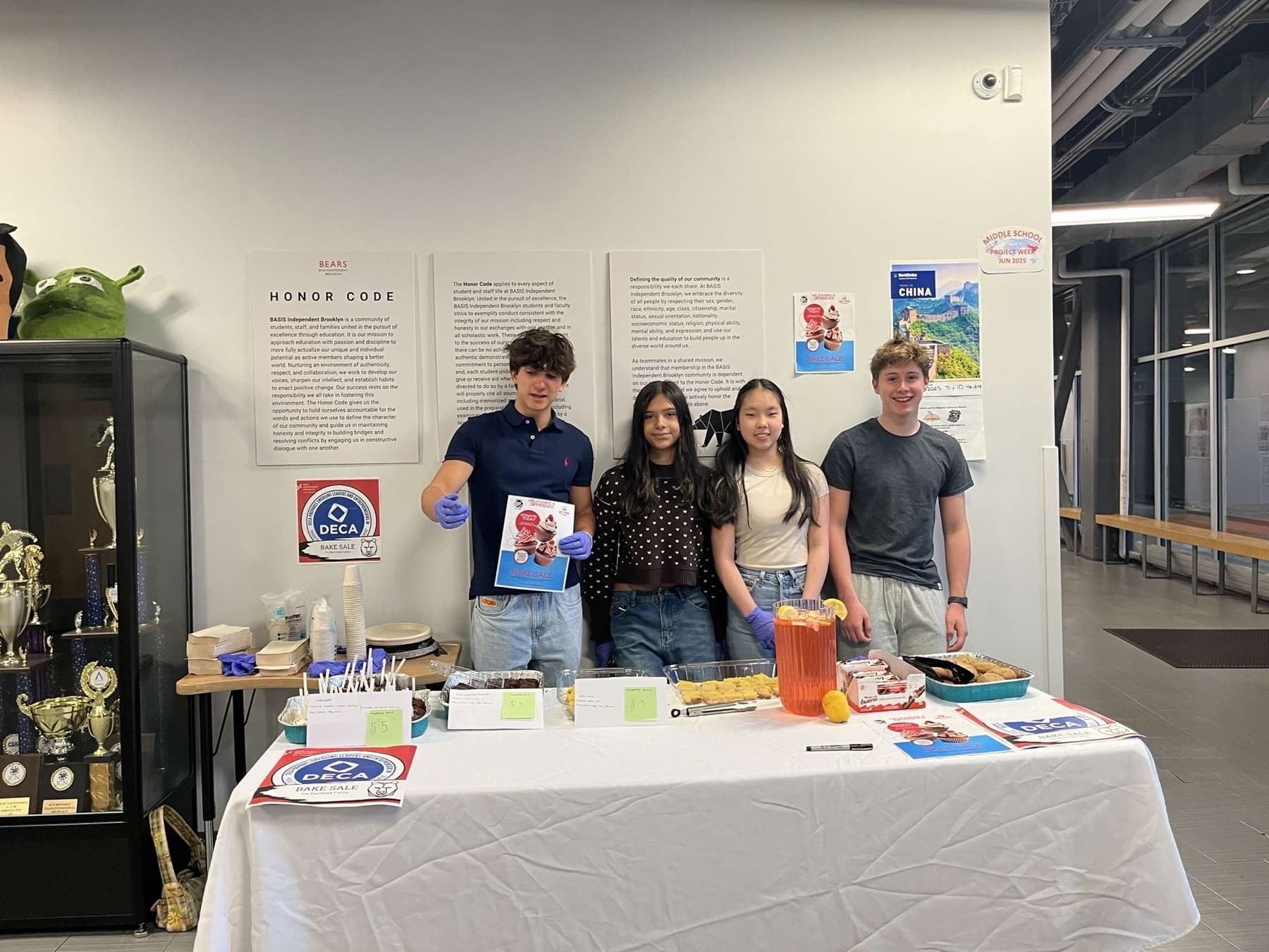 Student volunteers at a community bake sale